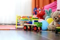 ChildrenÃ¢â¬â¢s multicolored toys on wooden floor or carpet on kids room